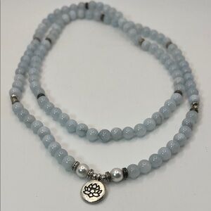 Elegant Silver and White Beaded Necklace with Lotus Pendant